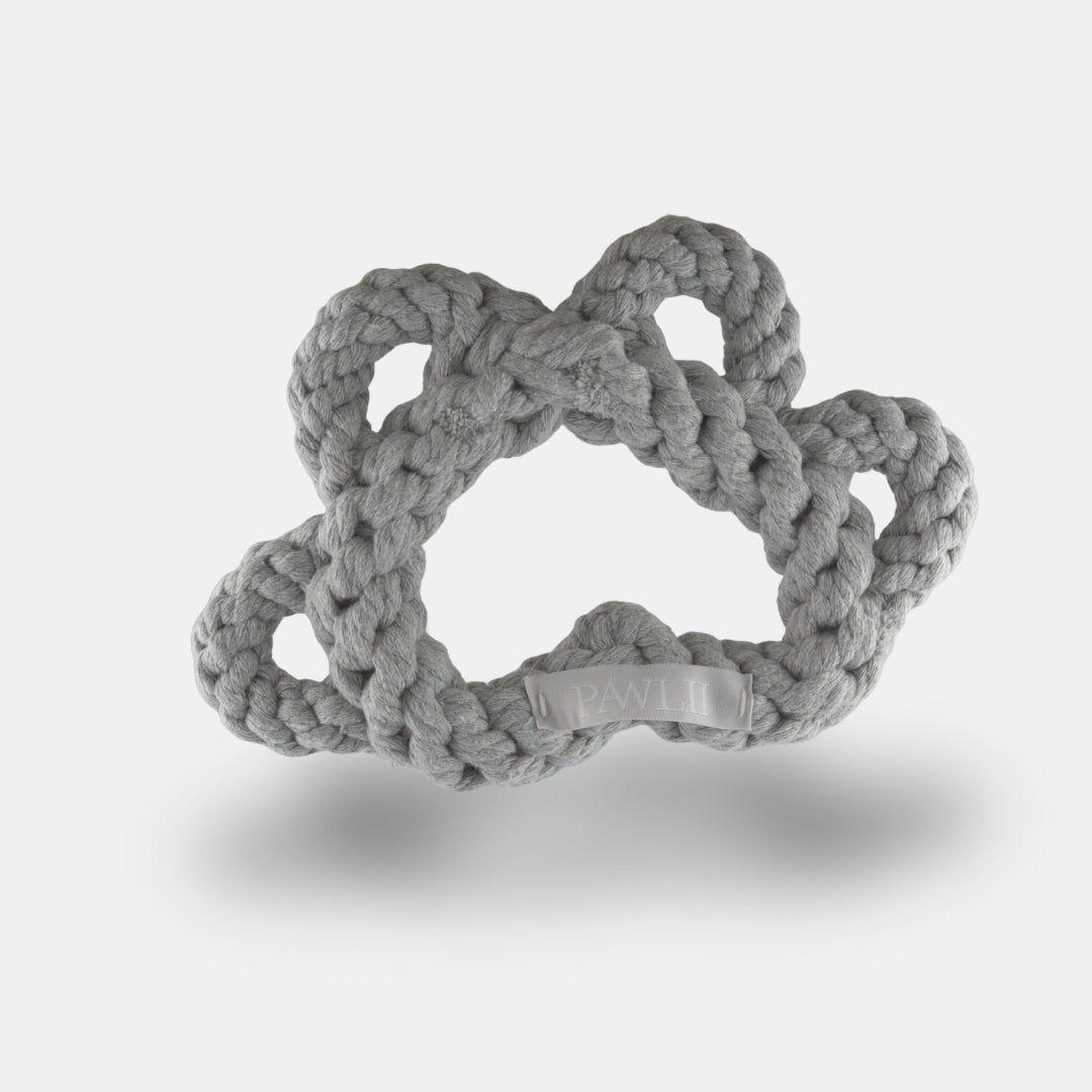 Kauspielzeug aus Baumwolle in Form einer Pfote in der Farbe grau.